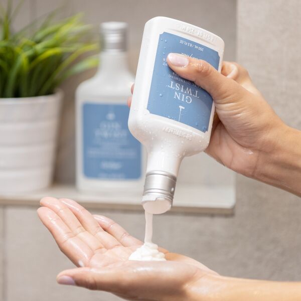 Gin Twist Curl Quenching Conditioner being squeezed out of bottle
