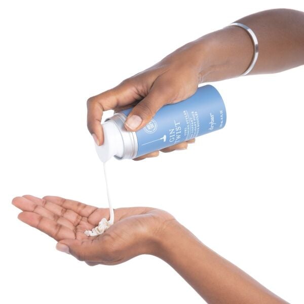Gin Twist Curl Conditioning Styler being applied into hand
