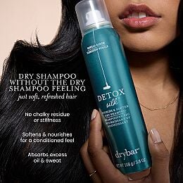 Drybar Detox Silk Nourish & Soften Dry Shampoo bottle beside smooth dark hair with text highlighting softness, oil absorption, and no chalky residue.